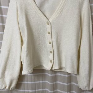Bubble sleeve cardigan top. Never worn. New without tags. Cream.